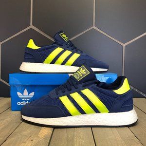 navy blue and yellow adidas shoes